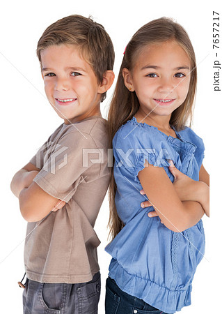 Children standing back to back with their arms crossed 7657217