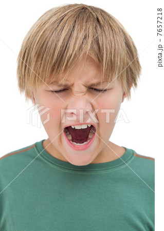 Furious little boy shouting with eyes closed 7657218