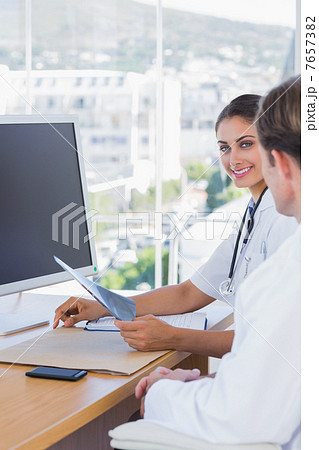 Beautiful nurse holding a x ray Beautiful nurse holding a x ray 7657382