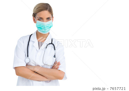 Nurse wearing surgical mask with arms crossed Nurse wearing surgical mask with arms crossed 7657721