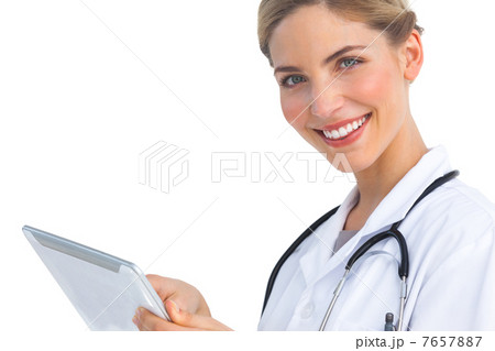 Smiling nurse with tablet pc 7657887