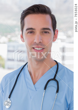 Practitioner standing in his office 7658024
