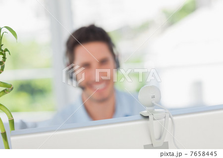Happy designer having a video chat Happy designer having a video chat 7658445