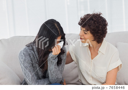 Patient crying next to her therapist 7658446