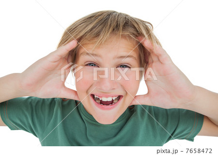 Amazed boy smiling with hands raised Amazed boy smiling with hands raised 7658472