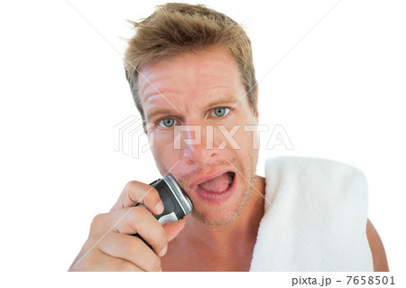 Handsome man shaving his stubble 7658501