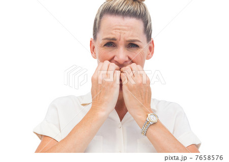 Businesswoman biting nails Businesswoman biting nails 7658576