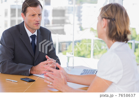 Businessman having a discussion with a job applicant Businessman having a discussion with a job applicant 7658637