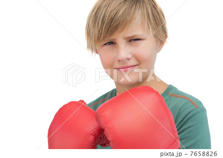 Smiling boy with boxing gloves 7658826