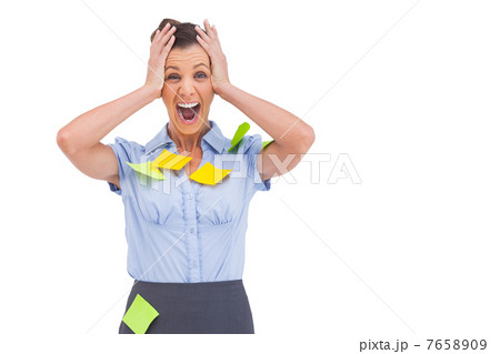 Businesswoman shouting with adhesive notes on her shirt 7658909