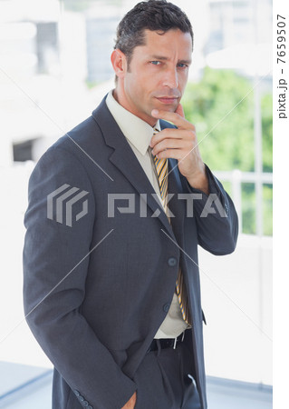 Handsome businessman thinking 7659507