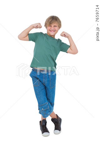 Happy blonde boy tensing arm muscles Happy blonde boy tensing arm muscles 7659714
