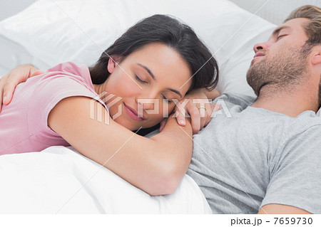 Woman sleeping on her husbands chest Woman sleeping on her husbands chest 7659730