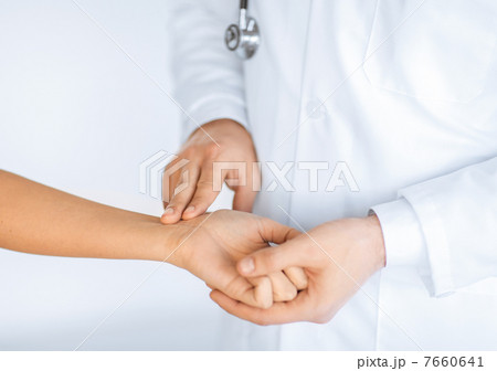 doctor measuring patient heart beat 7660641