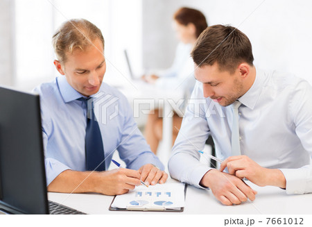businessmen with notebook on meeting 7661012