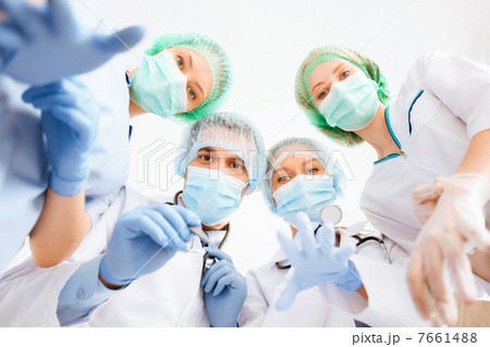 group of doctors in operating room 7661488
