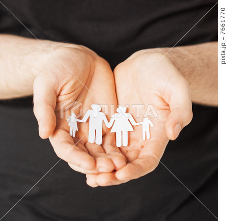 man hands with paper men 7661770