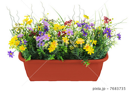 Composition of artificial garden flowers in brown flowerpot isol Composition of artificial garden flowers in brown flowerpot isol 7683735