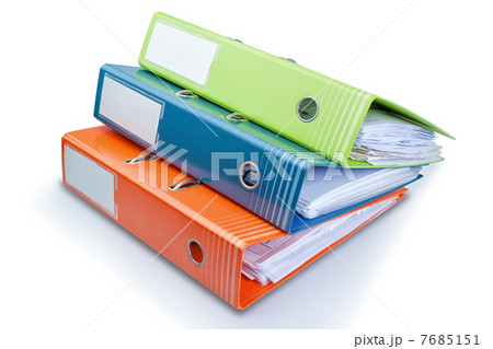 Stationery Office folder on the table with papers. On a white ba 7685151