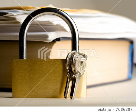 Key lock against the background of paper Key lock against the background of paper 7686887