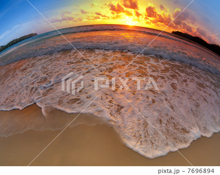 wide angle shot of beach on sunset 7696894