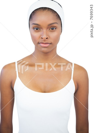 Serious woman wearing white headband Serious woman wearing white headband 7699343