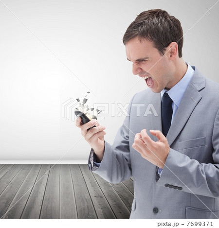 Furious businessman screaming Furious businessman screaming 7699371