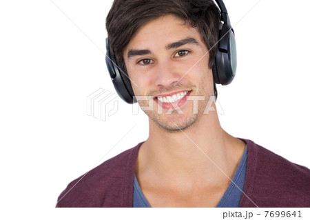 Handsome man listening music Handsome man listening music 7699641
