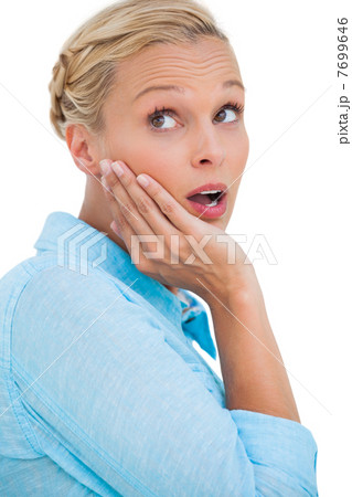 Surprised attractive blonde looking up 7699646