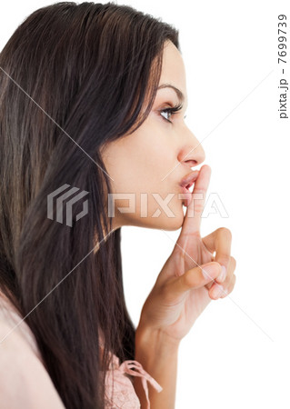 Woman making sign for quiet 7699739