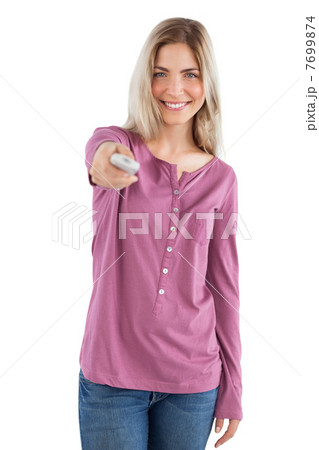 Smiling woman holding remote control 7699874