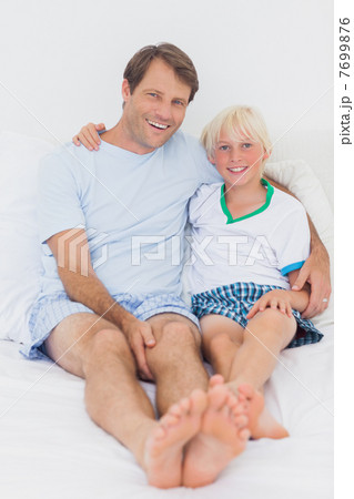 Portrait of a smiling father and son Portrait of a smiling father and son 7699876