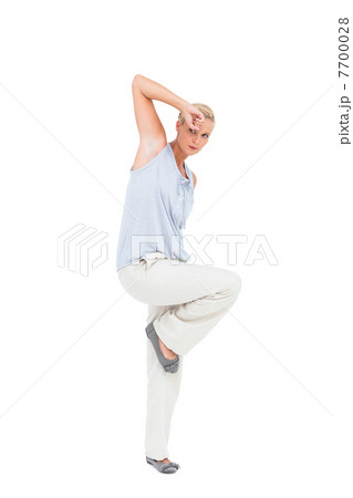 Blonde woman gesturing and looking at camera Blonde woman gesturing and looking at camera 7700028