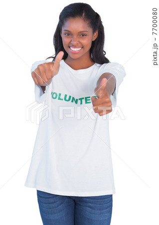 Young woman wearing volunteer tshirt and giving thumbs up Young woman wearing volunteer tshirt and giving thumbs up 7700080
