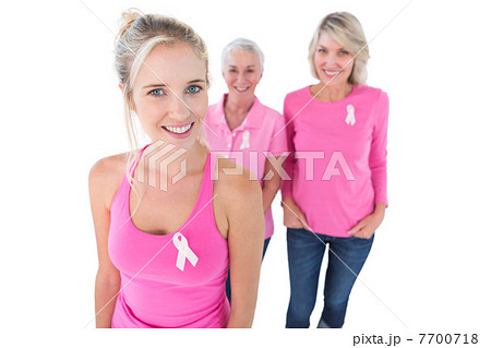 Three generations of women wearing pink tops and breast cancer r 7700718