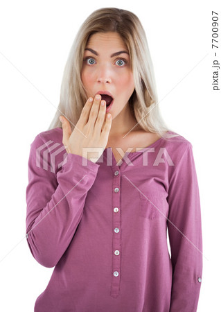 Surprised woman with hand on mouth Surprised woman with hand on mouth 7700907