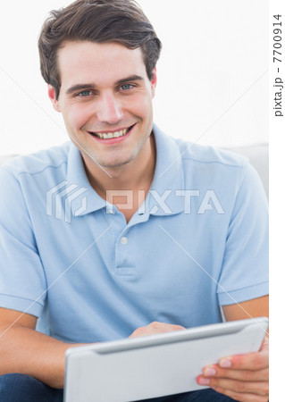 Man using his tablet Man using his tablet 7700914