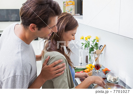 Couple cooking in kitchen 7701027