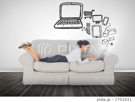 Businesswoman lying on a sofa 7701031