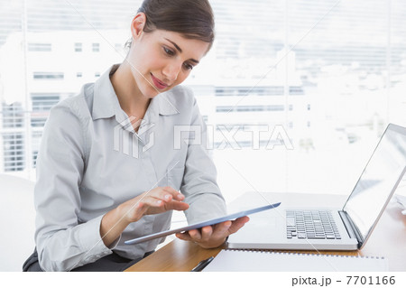 Businesswoman using digital tablet 7701166
