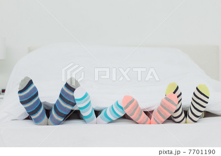 Familys feet in stripey socks 7701190