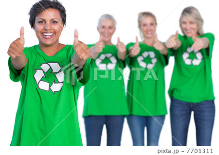 Happy women wearing green recycling tshirts giving thumbs up Happy women wearing green recycling tshirts giving thumbs up 7701311