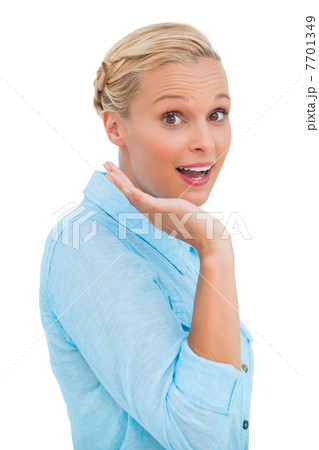 Astonished blonde woman looking at camera Astonished blonde woman looking at camera 7701349