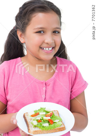 Little girl showing her sandwich to camera Little girl showing her sandwich to camera 7701362