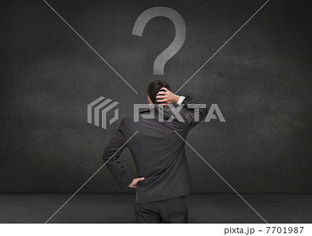 Rear view of a thoughtful businessman Rear view of a thoughtful businessman 7701987