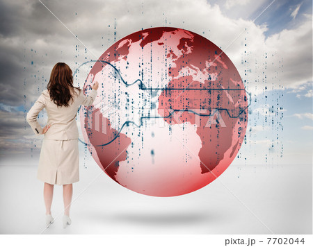 Businesswoman drawing a key over a red planet Businesswoman drawing a key over a red planet 7702044