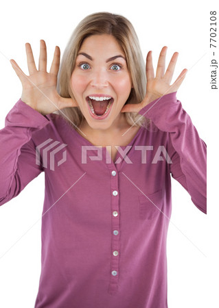 Surprised young woman raising hands 7702108
