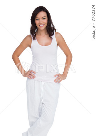 Smiling woman posing with hands on hip Smiling woman posing with hands on hip 7702274