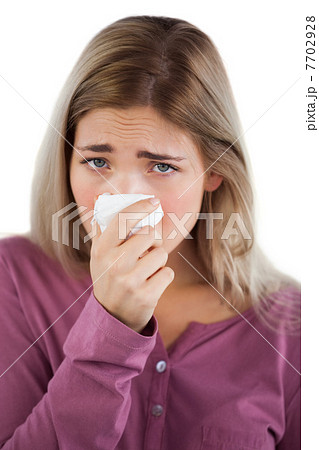 Woman using handkerchief 7702928