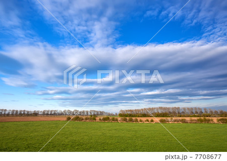 cloudscape over spring meadow 7708677